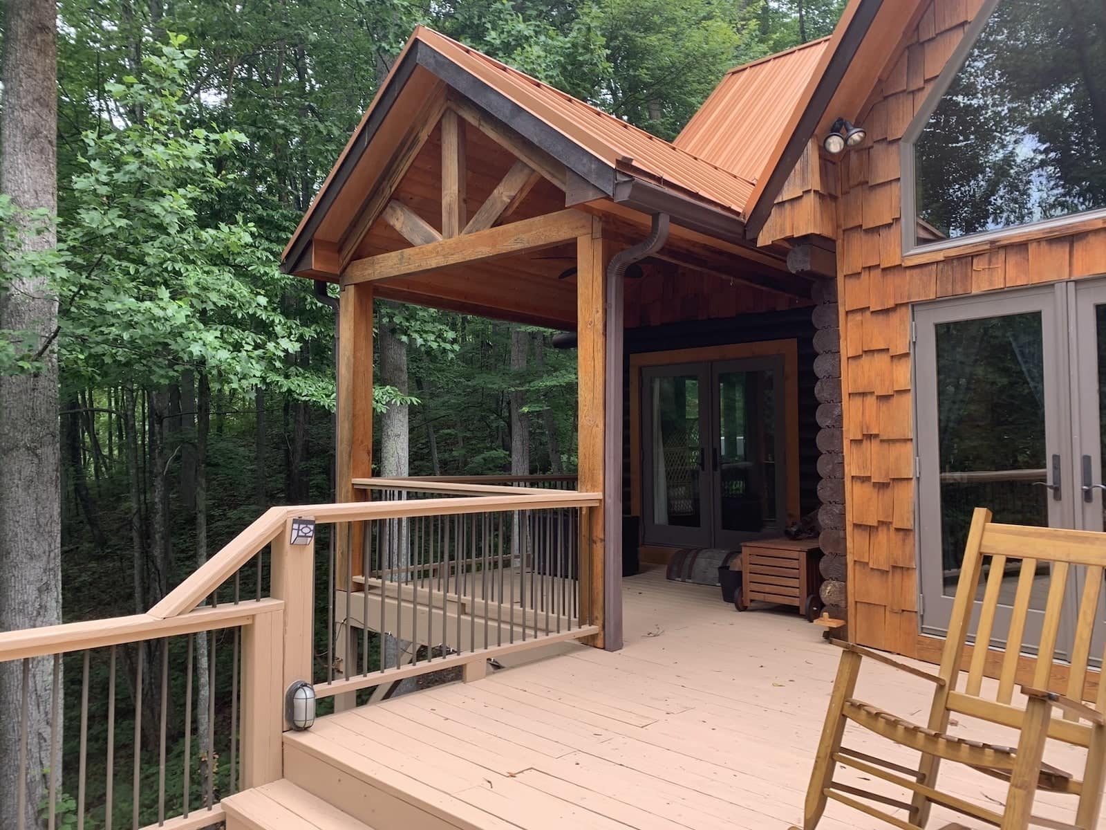 Exterior of front Nessi Homes corporate event cabin during sunset in Western North Carolina.