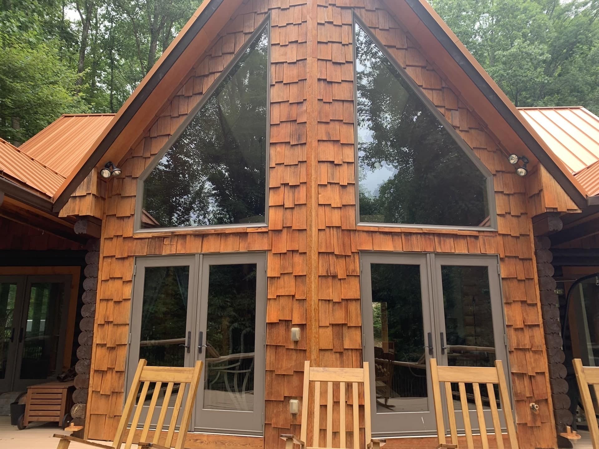 Exterior of porch Nessi Homes corporate event cabin during sunset in Western North Carolina.